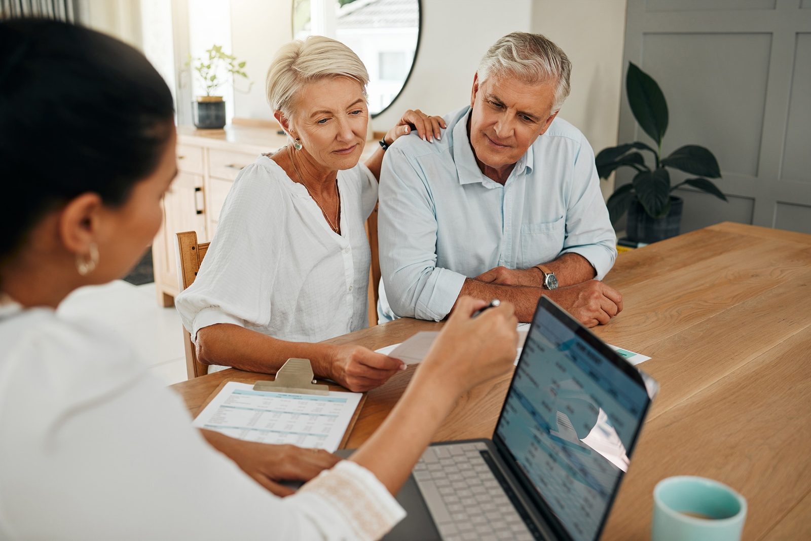 Advisor walking a couple through their financial plan at home